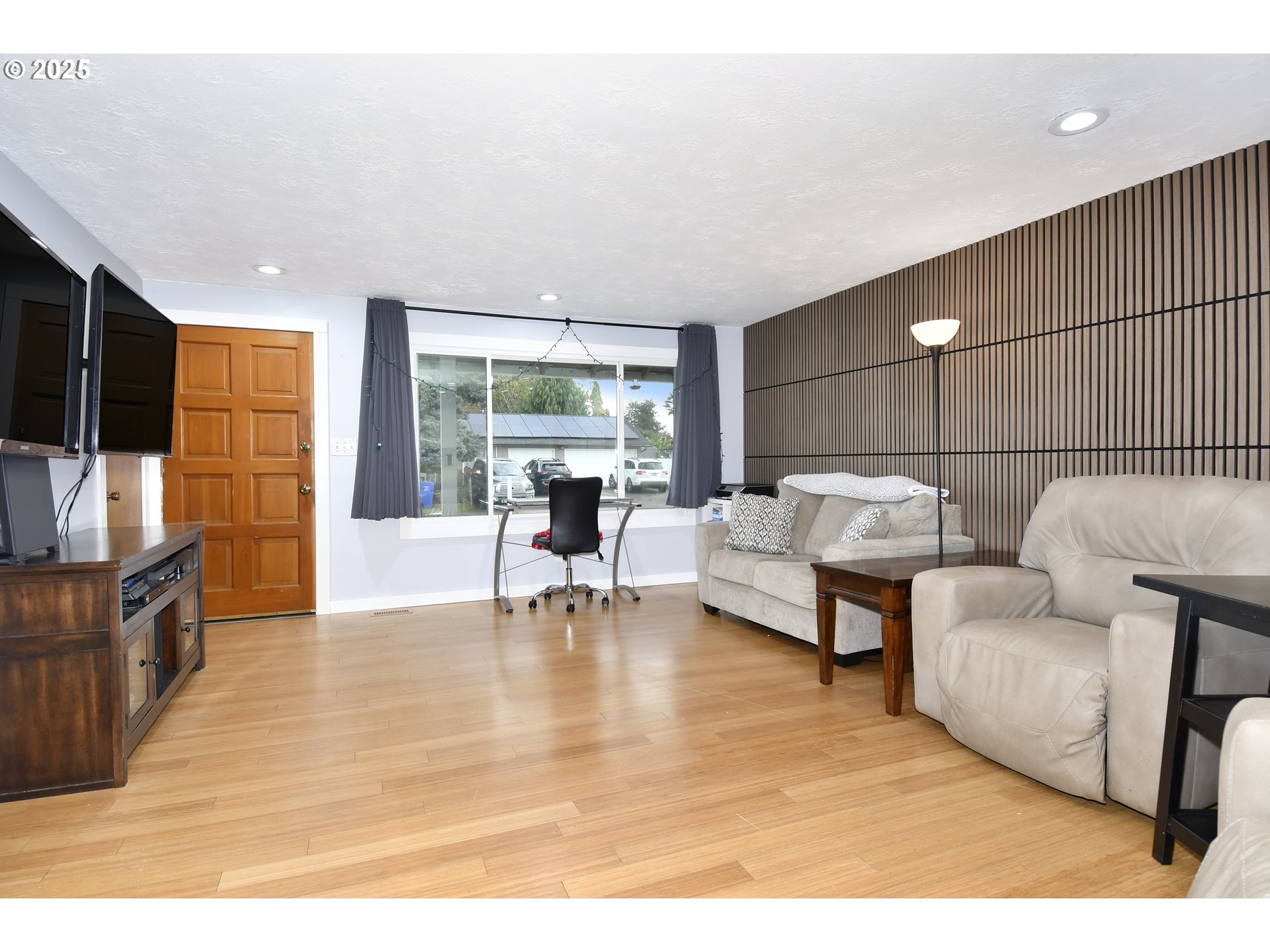 1889 Northeast Beech Avenue Gresham, OR 97030 - Photo 3 of 27 a living room with furniture and a flat screen tv