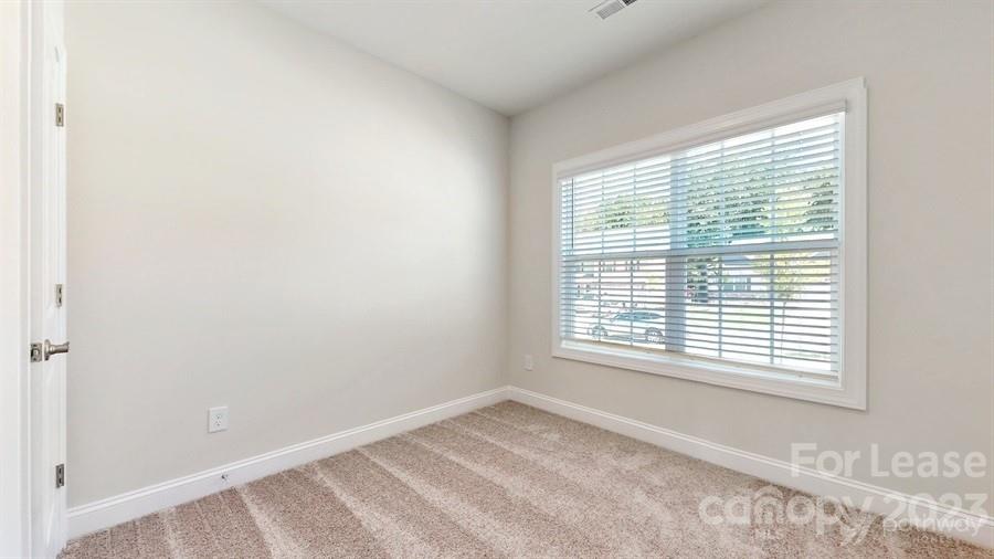 163 Tanner Loop Troutman, NC 28166 - Photo 12 of 27 a view of a room with a window