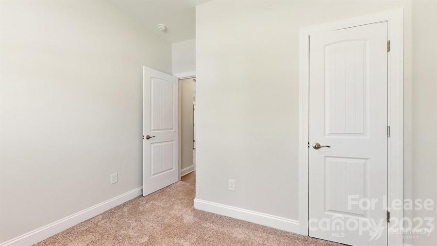 163 Tanner Loop Troutman, NC 28166 - Photo 13 of 27 a view of an empty room