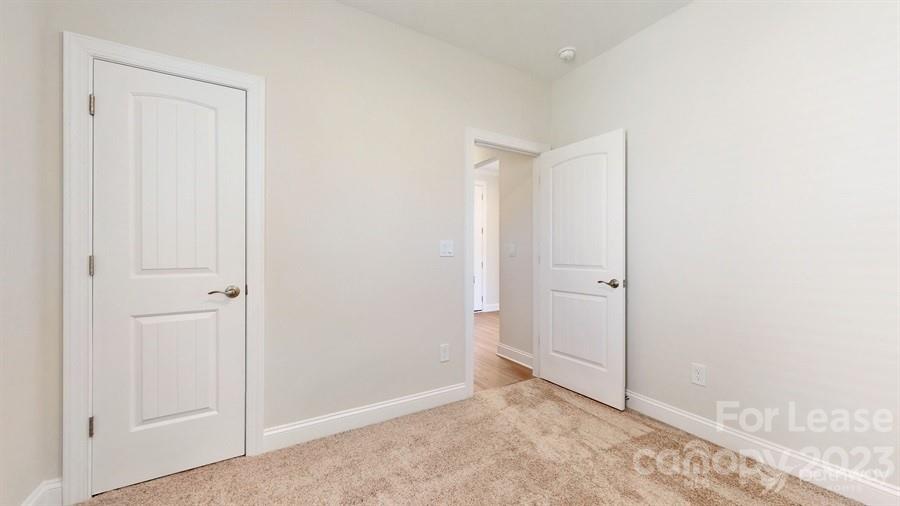 163 Tanner Loop Troutman, NC 28166 - Photo 15 of 27 a view of an empty room