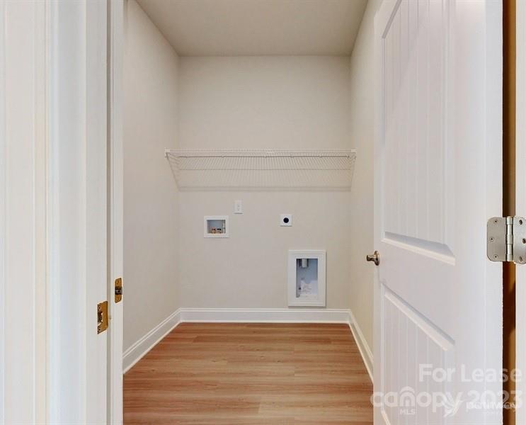 163 Tanner Loop Troutman, NC 28166 - Photo 17 of 27 a view of a room with wooden floor