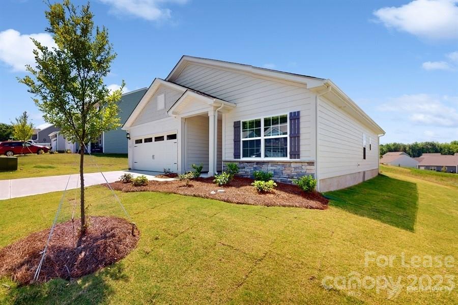163 Tanner Loop Troutman, NC 28166 - Photo 2 of 27 a view of a house with swimming pool and sitting area