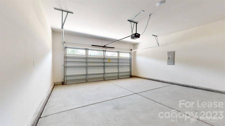 163 Tanner Loop Troutman, NC 28166 - Photo 23 of 27 a view of a garage