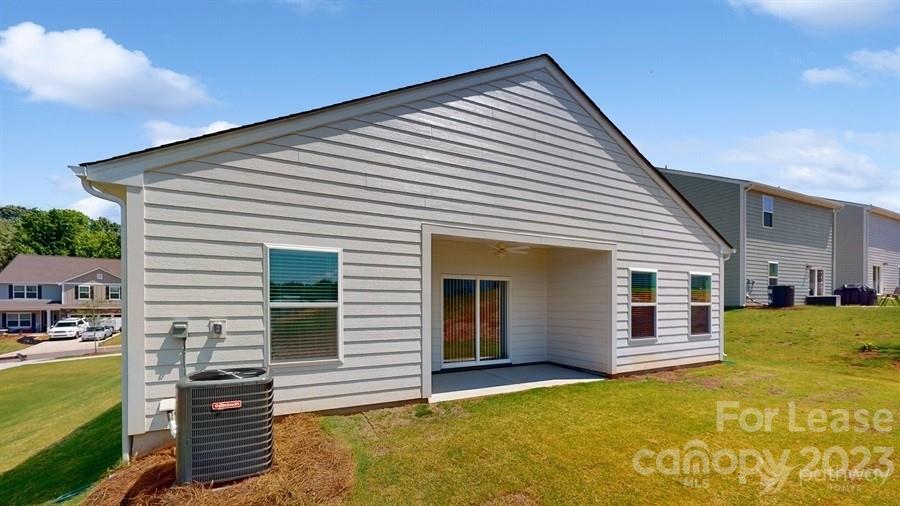 163 Tanner Loop Troutman, NC 28166 - Photo 26 of 27 a view of a house with a backyard