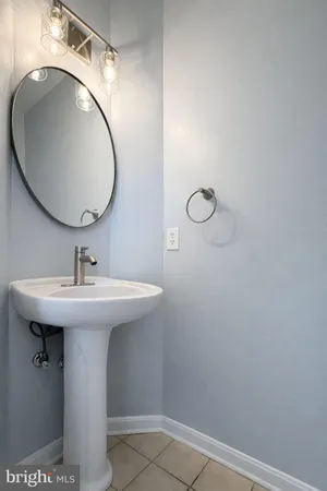 a bathroom with a sink and mirror
