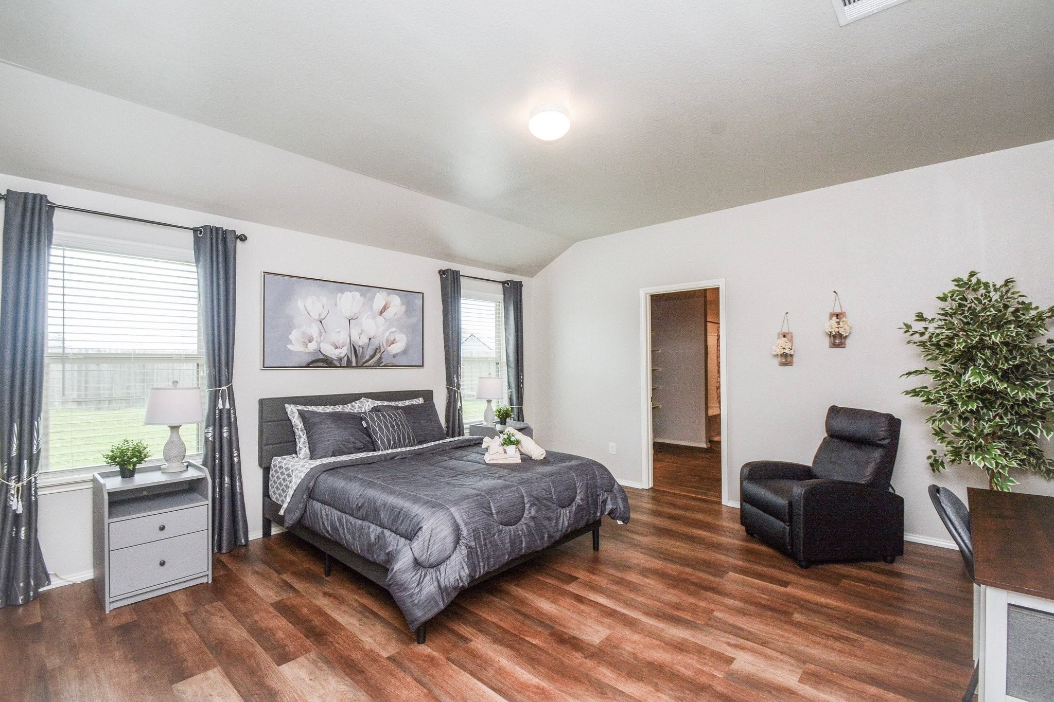 23510 Harrow Fld Lane Spring, TX 77373 - Photo 12 of 18 a spacious bedroom with a large bed and a couch