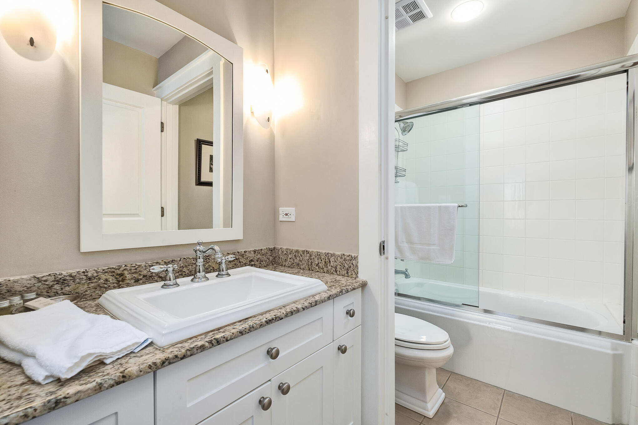 337 Bridge Lane, Unit 103B Inlet Beach, FL 32461 - Photo 13 of 37 a bathroom with a granite countertop sink toilet and shower
