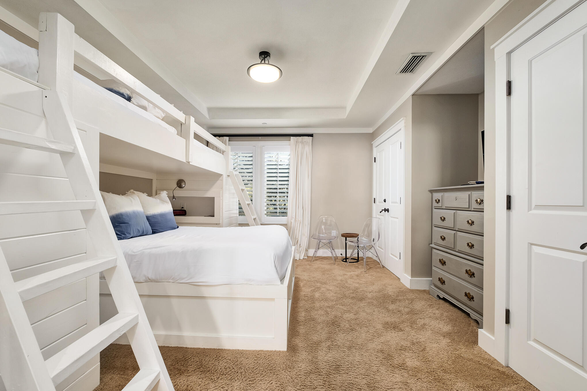 337 Bridge Lane, Unit 103B Inlet Beach, FL 32461 - Photo 15 of 37 a bed room with a bed and a chair