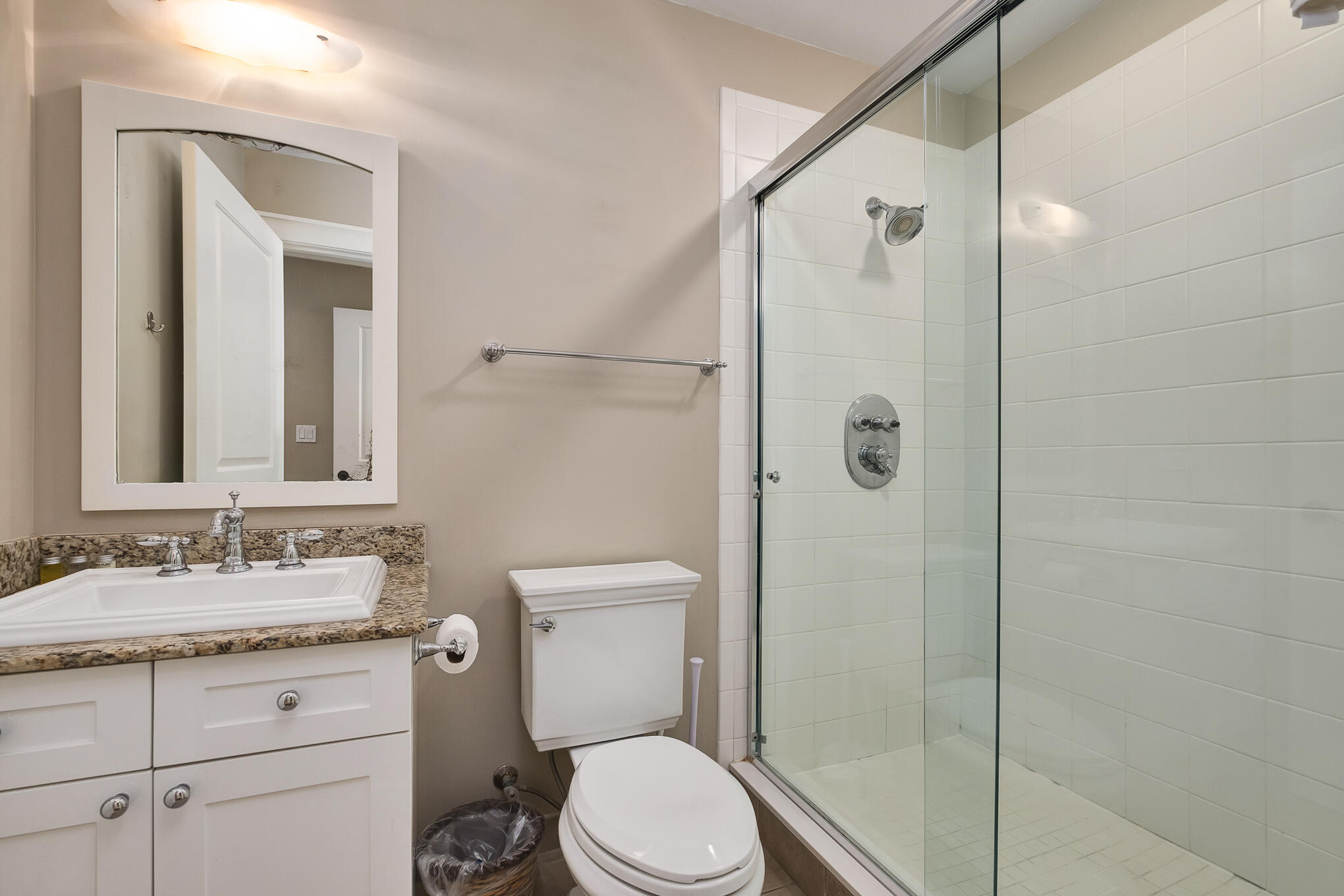 337 Bridge Lane, Unit 103B Inlet Beach, FL 32461 - Photo 16 of 37 a bathroom with a granite countertop sink toilet and shower