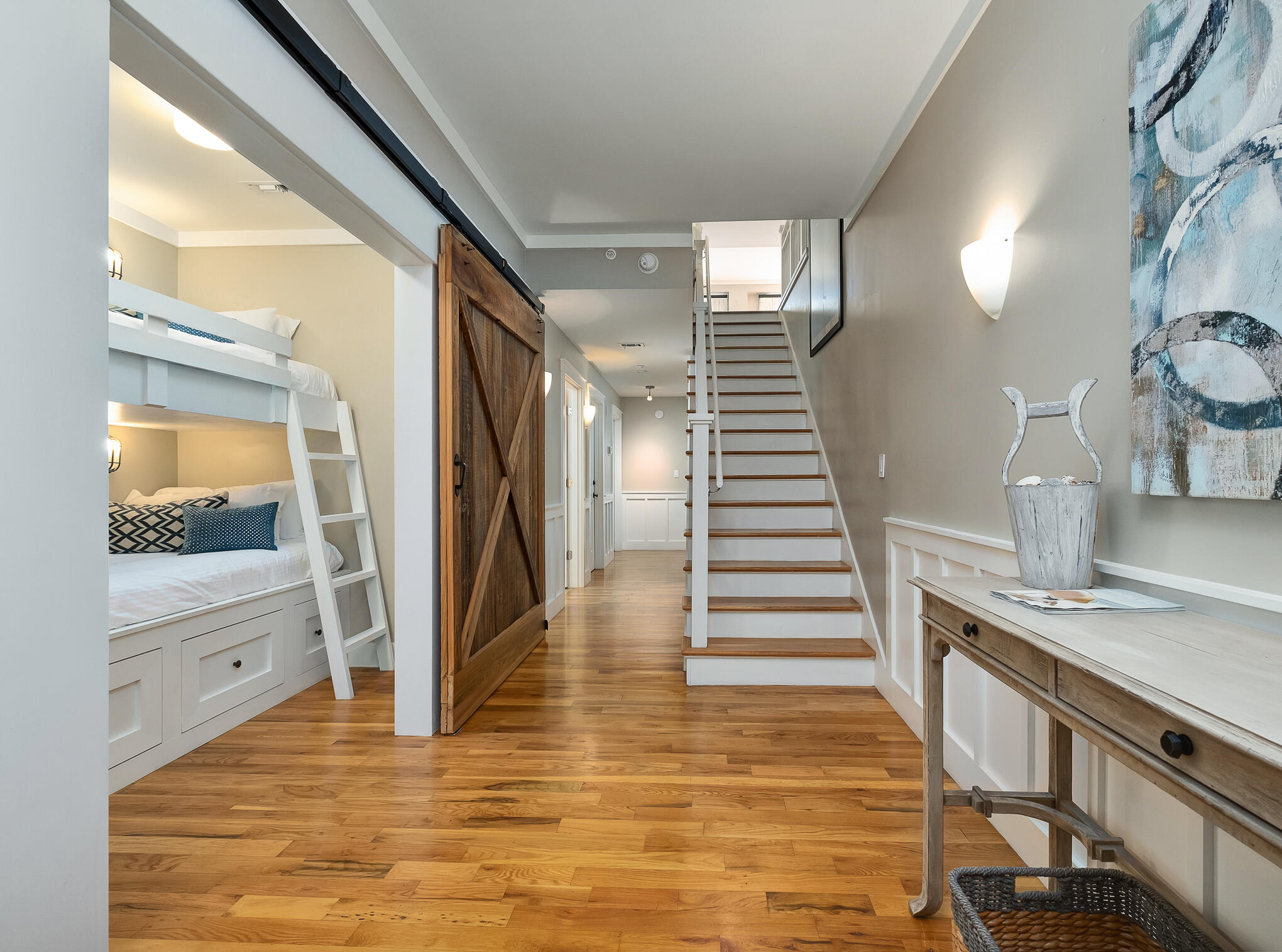 337 Bridge Lane, Unit 103B Inlet Beach, FL 32461 - Photo 24 of 37 a view of a kitchen with wooden floor and staircase