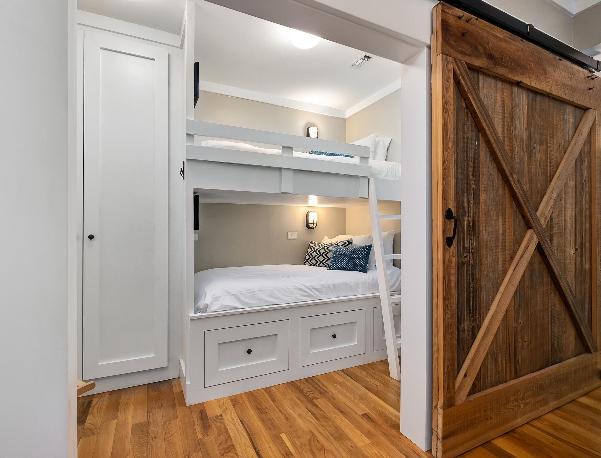 337 Bridge Lane, Unit 103B Inlet Beach, FL 32461 - Photo 25 of 37 a bedroom with a bed and wooden floor