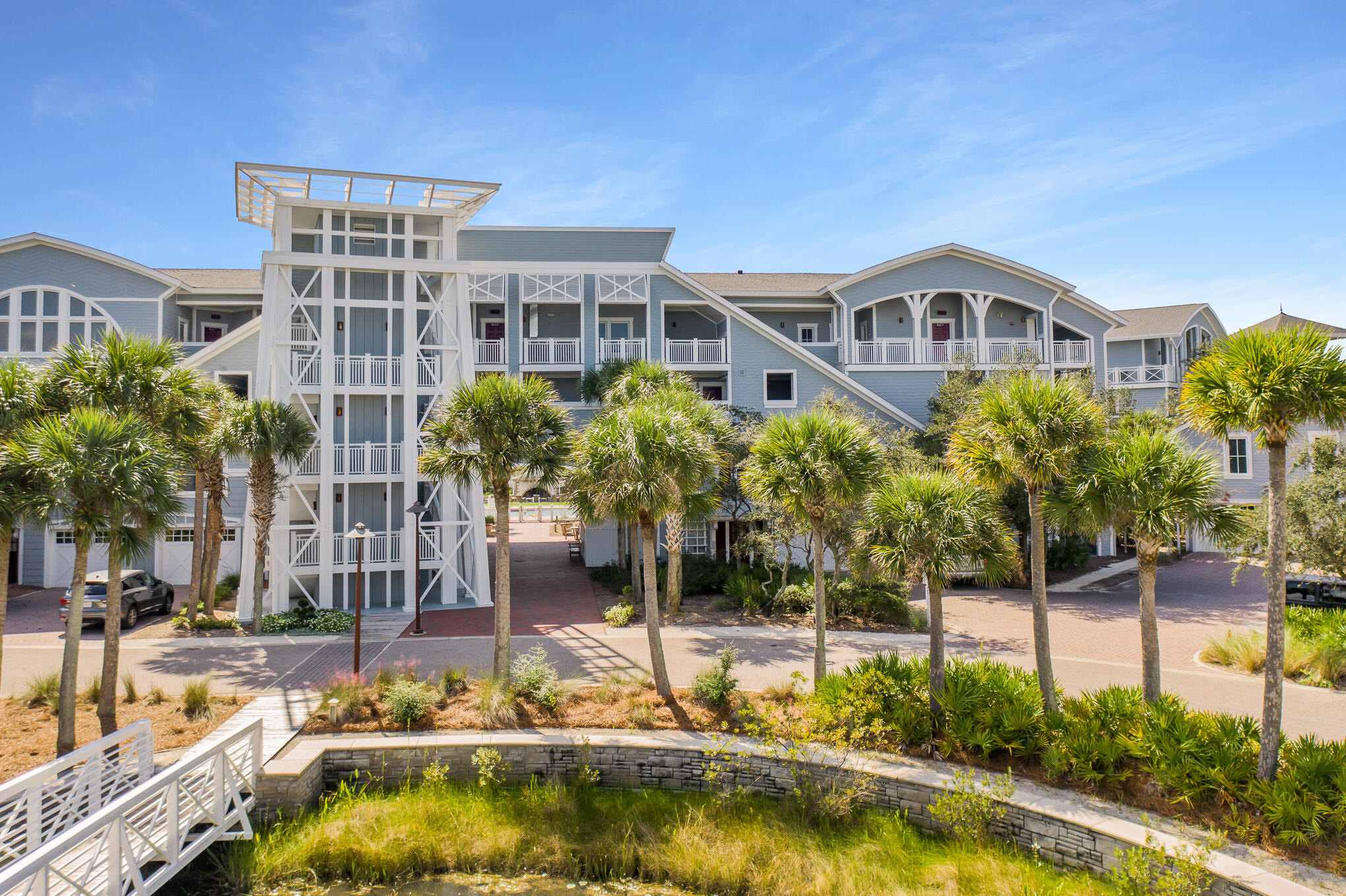 337 Bridge Lane, Unit 103B Inlet Beach, FL 32461 - Photo 28 of 37 a view of house with swimming pool and outdoor seating