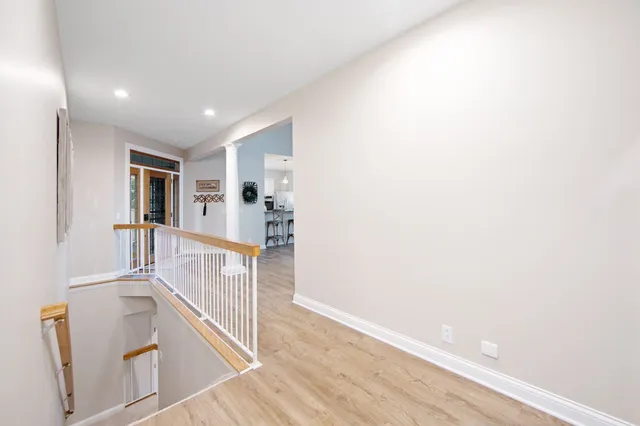a view of a kitchen with wooden floor