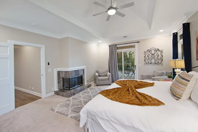 a bedroom with a bed and a fireplace