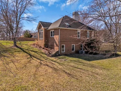 a house with trees in the background