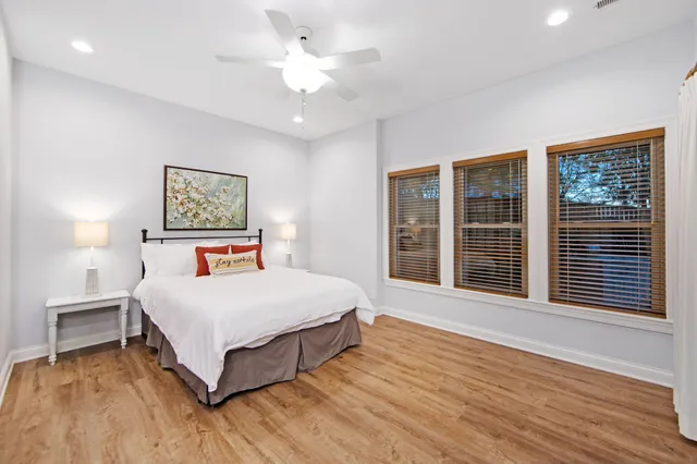 a spacious bedroom with a large bed and a large window