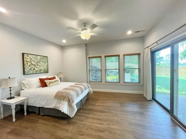 a bathroom with a shower sink vanity and mirror