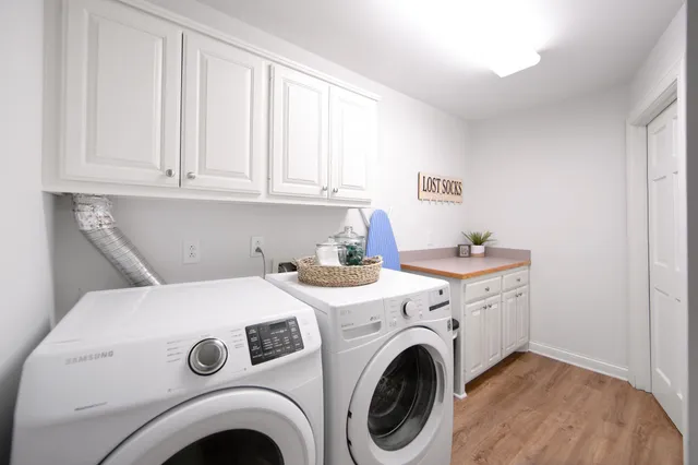 a bedroom with a bed and large window