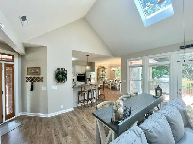 a living room with furniture and a table