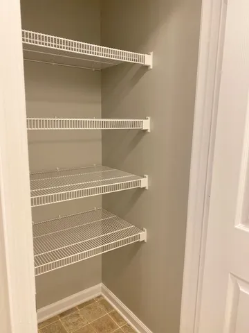 a view of a room with racks on the wall