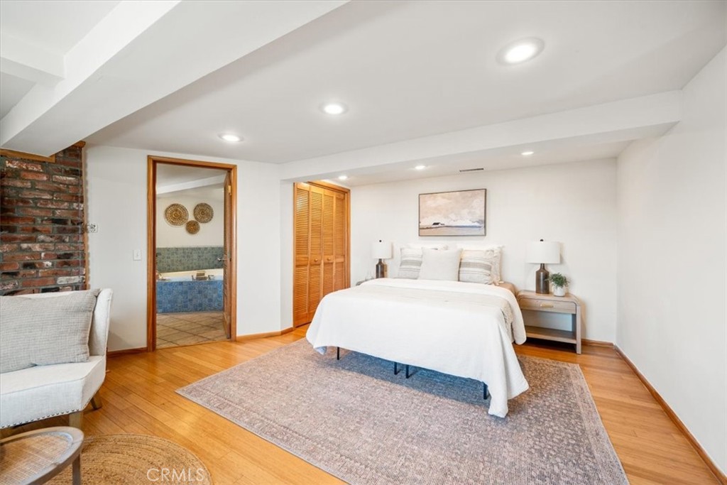 549 Derby Lane Paso Robles, CA 93446 - Photo 18 of 64 a spacious bedroom with a large bed and a couch