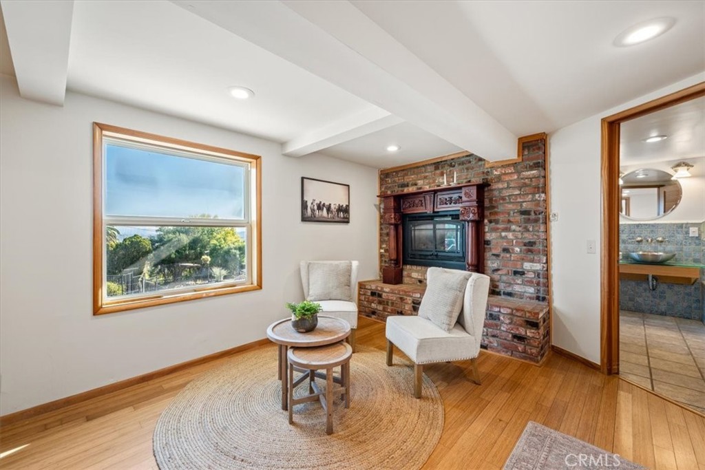 549 Derby Lane Paso Robles, CA 93446 - Photo 20 of 64 a living room with furniture a lamp a rug and a window