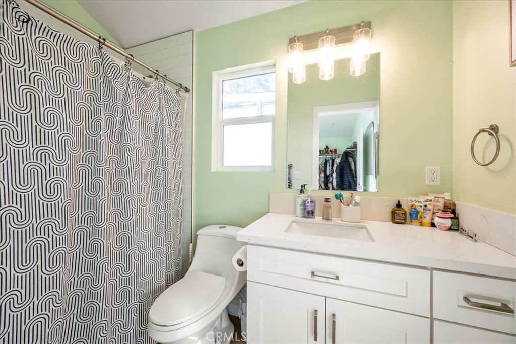 549 Derby Lane Paso Robles, CA 93446 - Photo 54 of 64 a bathroom with a sink vanity mirror and toilet