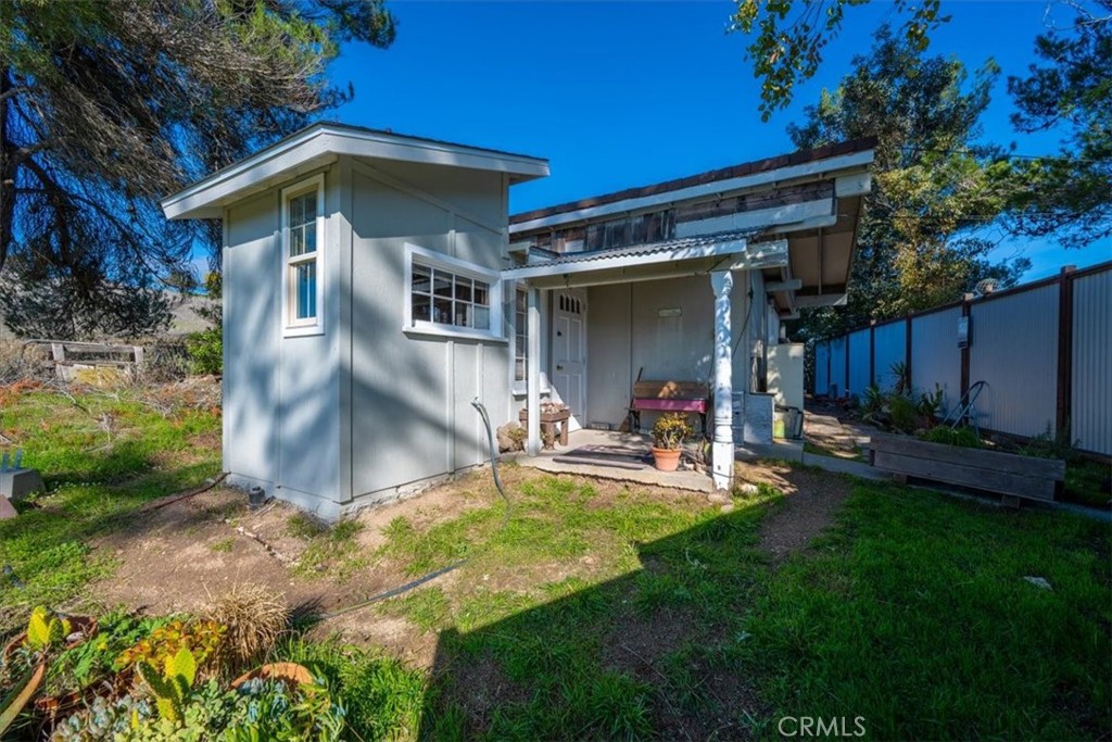 549 Derby Lane Paso Robles, CA 93446 - Photo 57 of 64 a view of a backyard with table and chairs under an umbrella