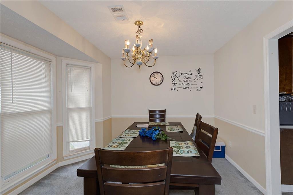 6834 Aldora Drive Columbus, GA 31907 - Photo 3 of 12 a view of a workspace with furniture and a window
