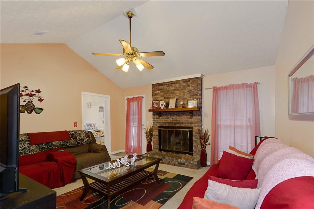 6834 Aldora Drive Columbus, GA 31907 - Photo 4 of 12 a living room with furniture fireplace and a flat screen tv