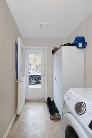 a view of entryway with washer and dryer