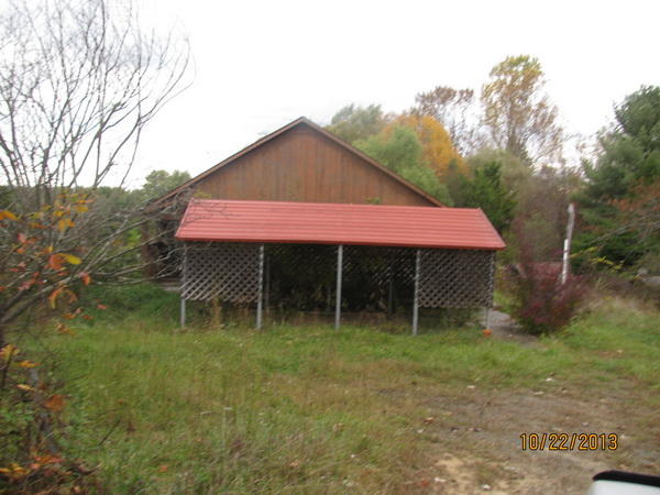 419 Short Road Northwest Riner, VA 24149 - Photo 1 of 11 a backyard of a house with table and chairs