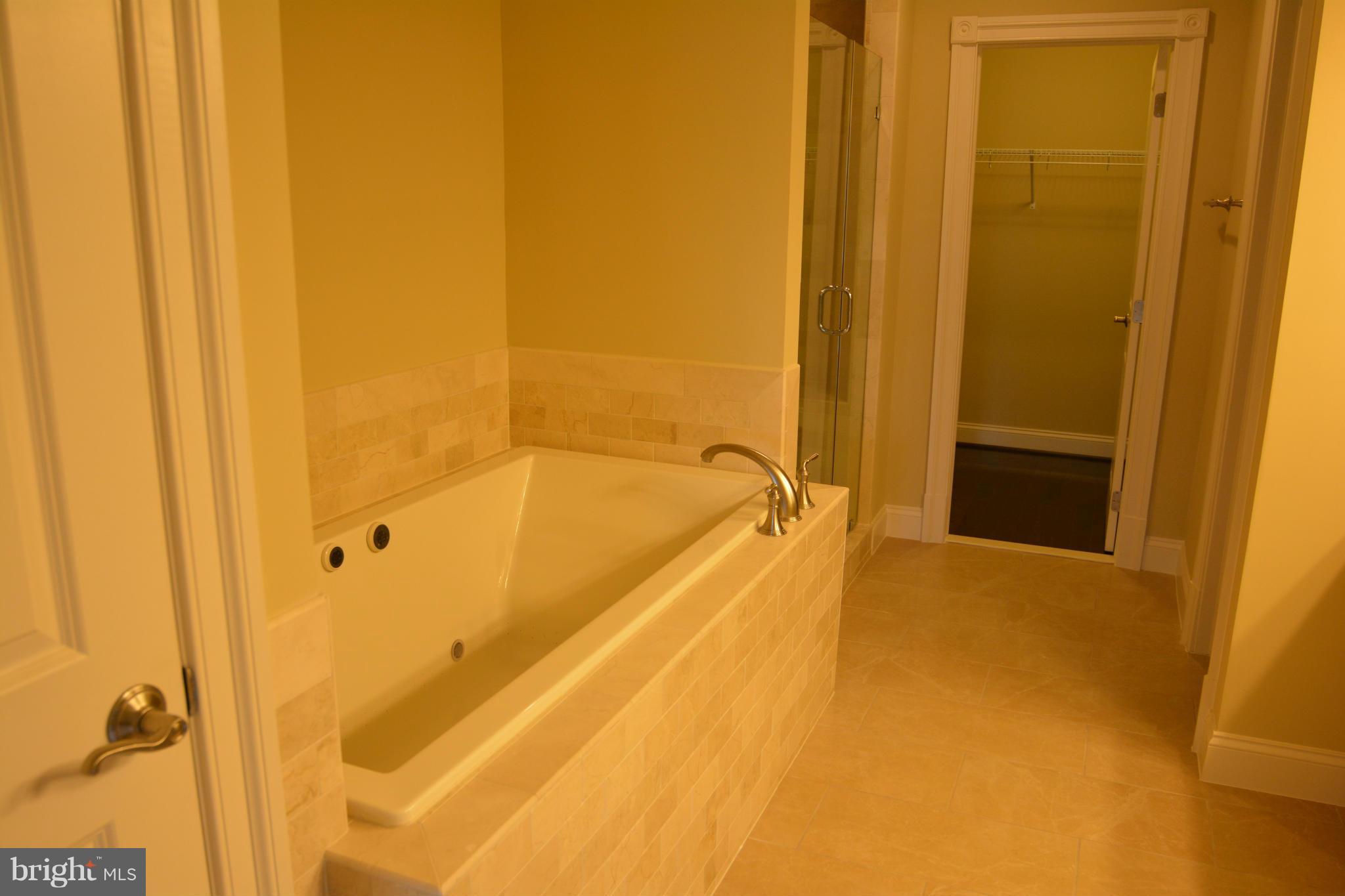 4526 Westhall Drive Washington, DC 20007 - Photo 15 of 20 a view of a bathroom with a tub and shower