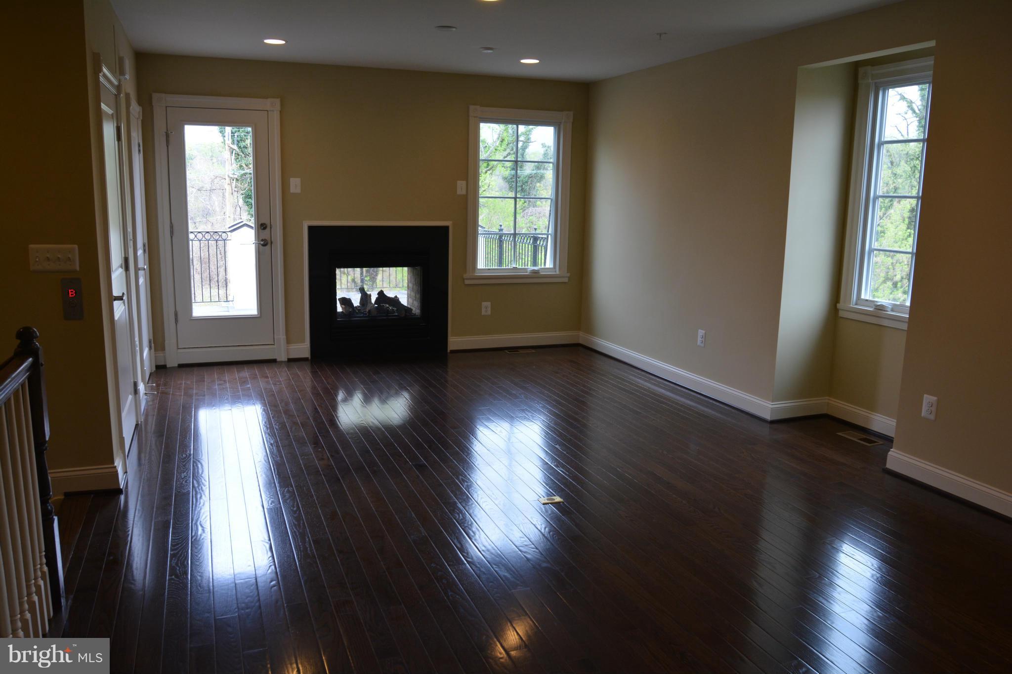4526 Westhall Drive Washington, DC 20007 - Photo 19 of 20 an empty room with wooden floor and windows