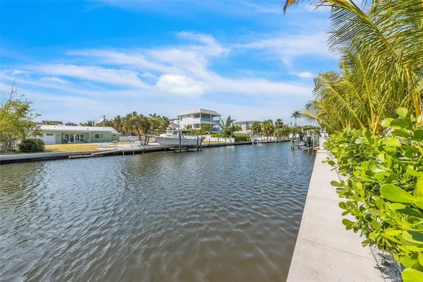 a view of roof deck with couches and city view