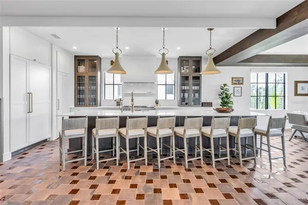 a bathroom with a sink mirror and bathtub