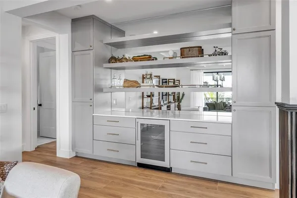 a bathroom with a double vanity sink toilet mirror and shower