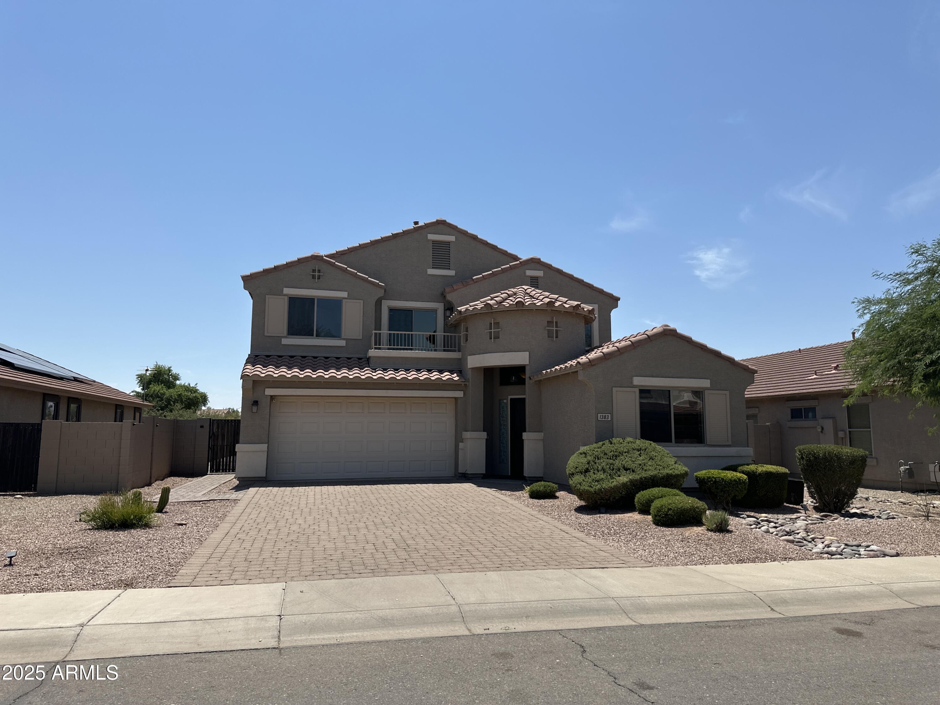 1383 East Kingman Place Casa Grande, AZ 85122 - Photo 2 of 18 a front view of a house with a yard and garage
