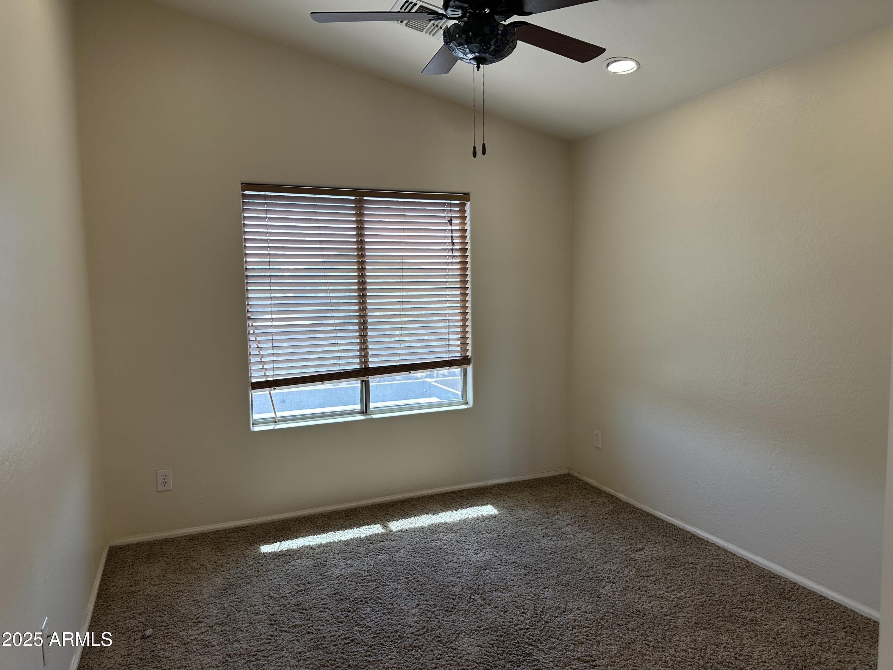 1383 East Kingman Place Casa Grande, AZ 85122 - Photo 10 of 18 an empty room with a window