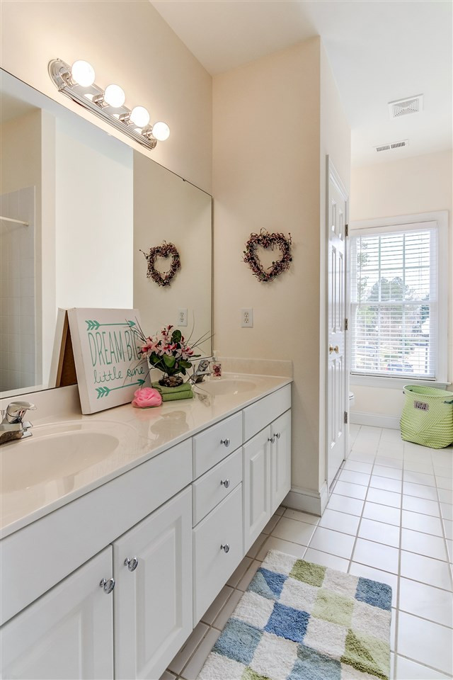 2401 Carruthers Court Raleigh, NC 27615 - Photo 22 of 25 2nd Floor Hall Bathroom