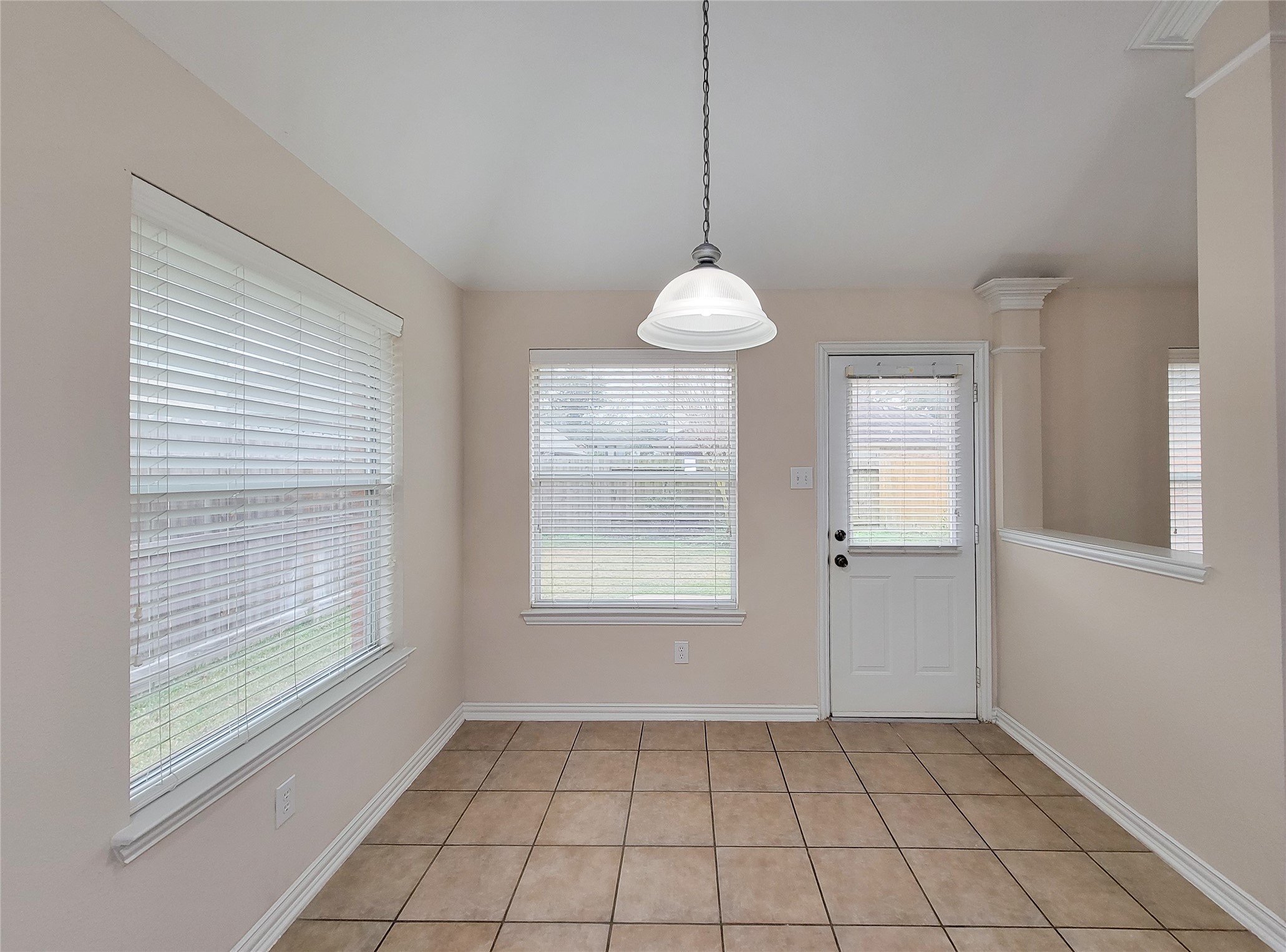 6806 Haley Court Pearland, TX 77584 - Photo 16 of 38 a view of an empty room with window and chandelier fan