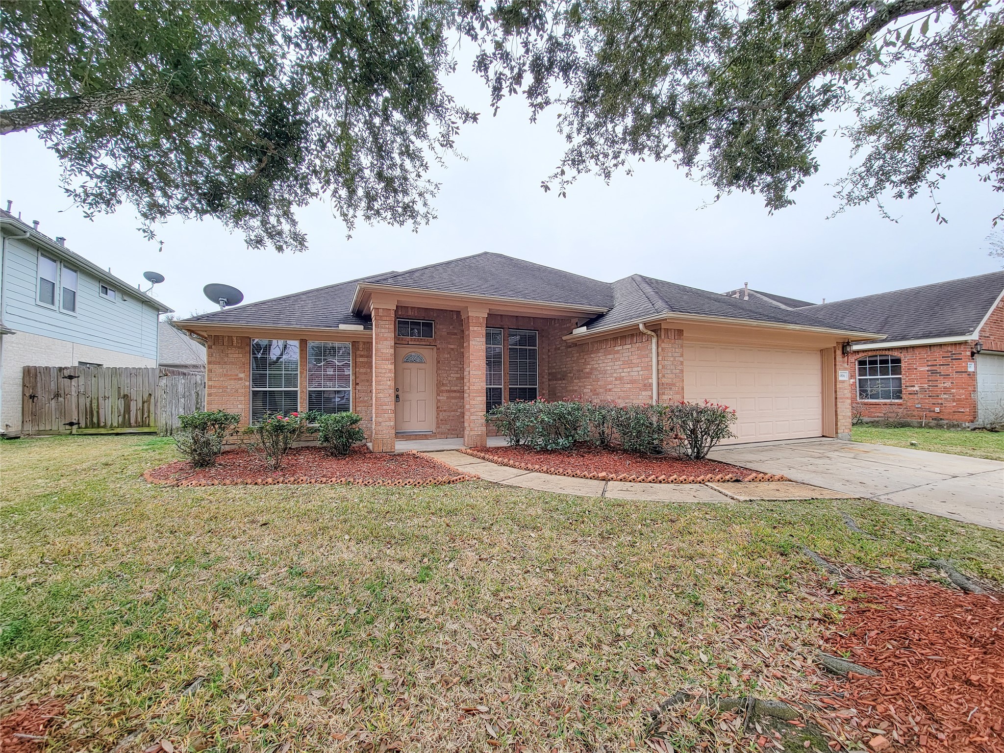 6806 Haley Court Pearland, TX 77584 - Photo 3 of 38 a front view of a house with a yard and garage
