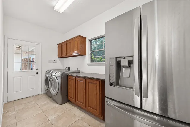 a bathroom with a glass shower door and a sink