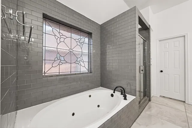 an aerial view of residential houses with outdoor space and street view