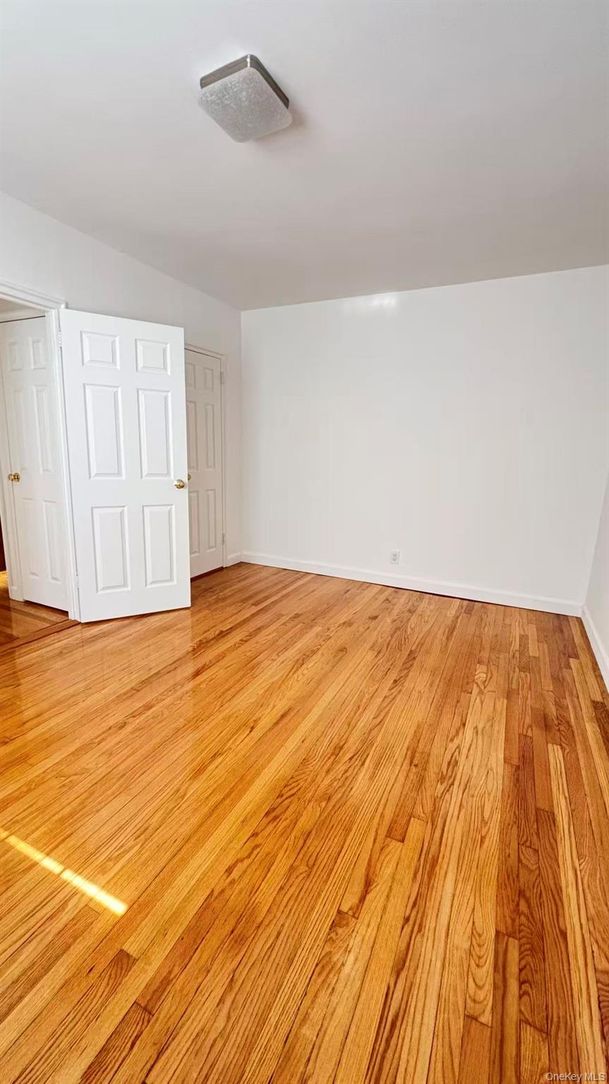 13806 78th Avenue, Unit 37D Queens, NY 11367 - Photo 4 of 11 wooden floor in a room