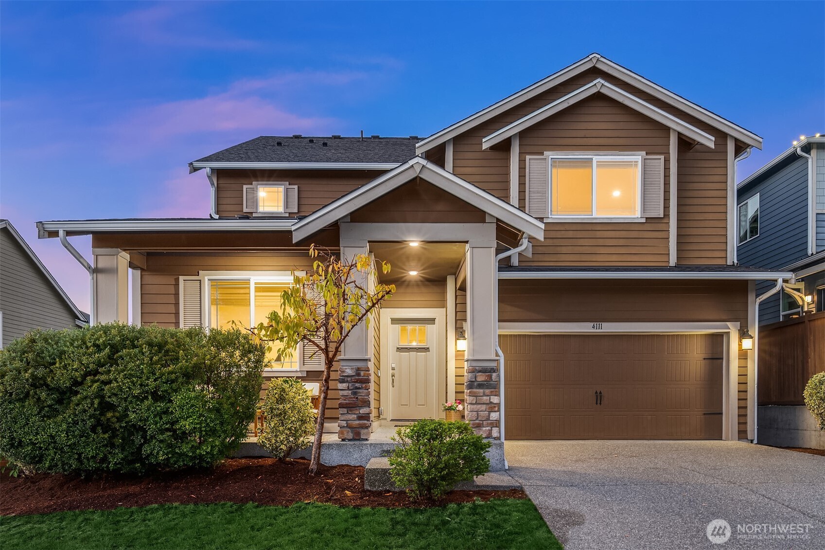 a front view of a house with garden