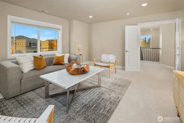 a living room with furniture and a rug