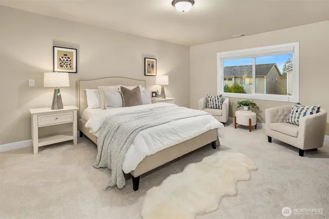 a bedroom with bed and a couch