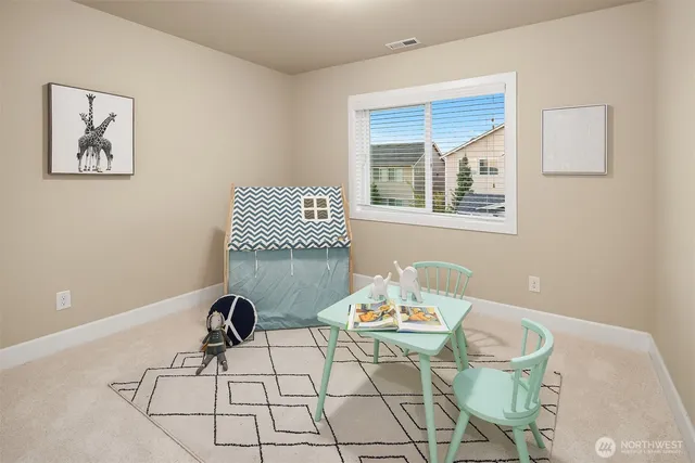 a view of a dining room that has a table and chairs