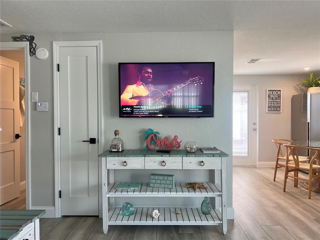 6154 Midnight Pass Road, Unit D02 Sarasota, FL 34242 - Photo 5 of 12 a view of cabinets and wooden floor